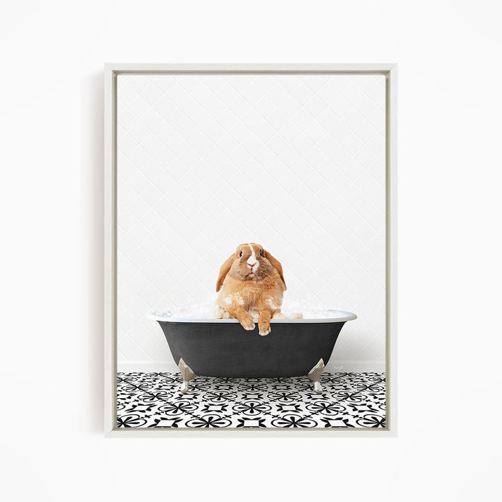 A brown rabbit sitting in a black bathtub filled with water, surrounded by a black and white patterned floor.