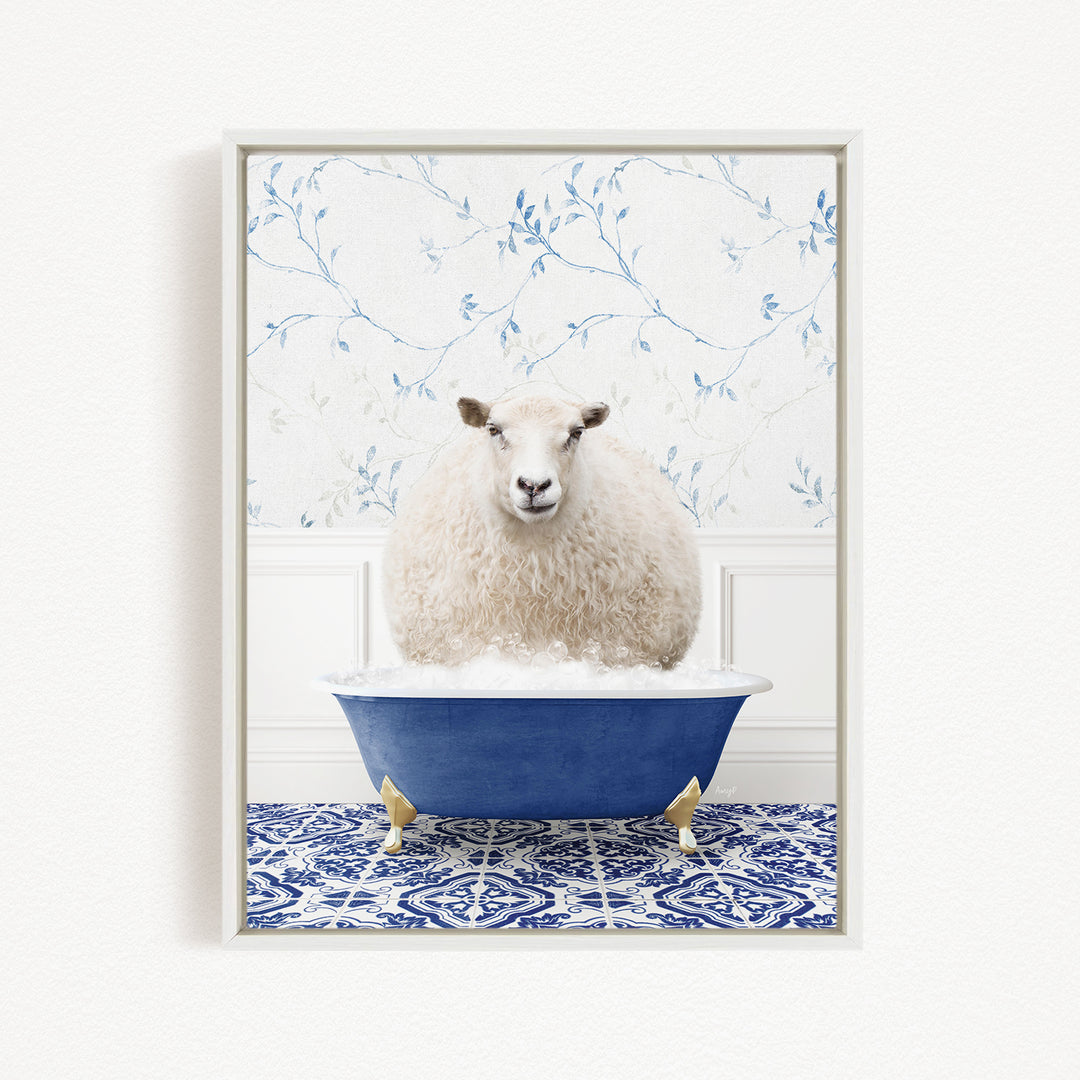 A fluffy white sheep sits in a blue bathtub, surrounded by a blue and white patterned floor and a floral wallpaper background.