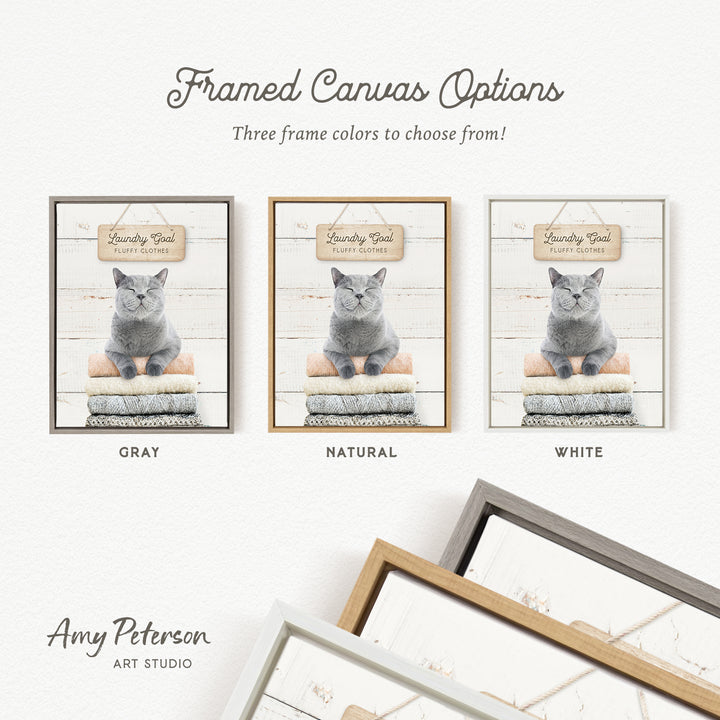 three framed canvas options, each featuring a gray cat sitting on a pile of laundry. The options include a gray frame, a natural frame, and a white frame.