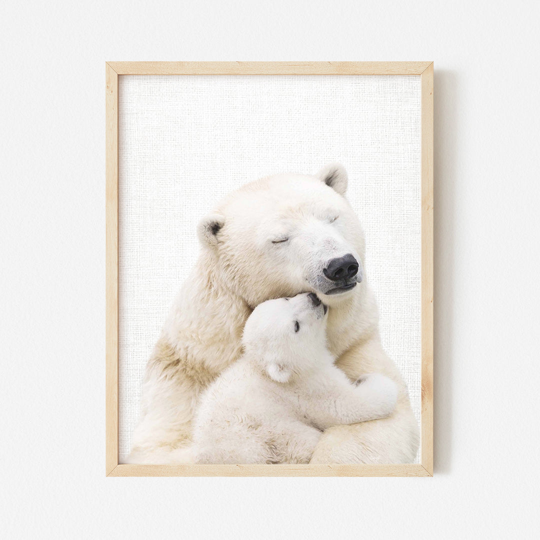 a polar bear holding a baby polar bear