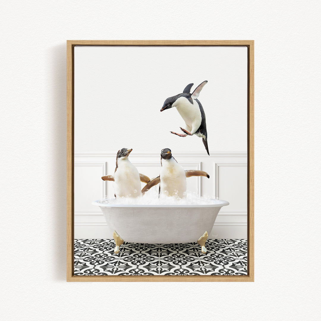 A framed image depicting three penguins sitting in a bathtub, with one penguin flying towards the others.