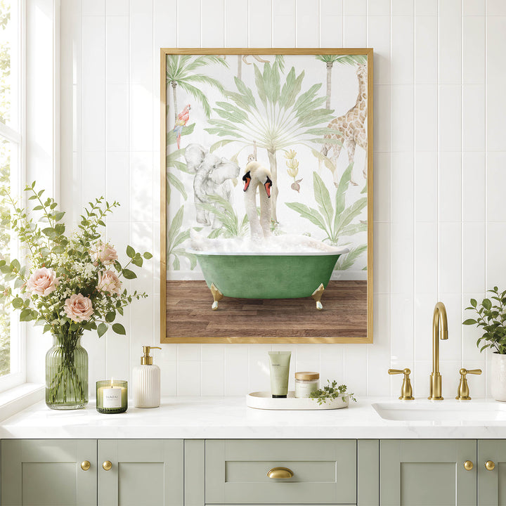 a bathroom with a green bathtub, a framed picture of a swan and giraffe, and a vase of pink flowers on the counter.