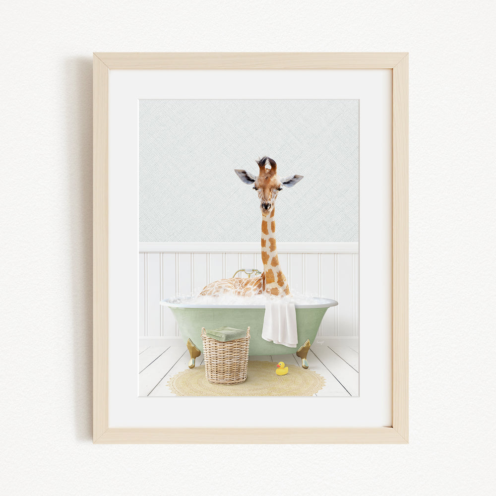 A giraffe standing in a green bathtub filled with bubbles, surrounded by a basket of toys and a yellow rubber duck.