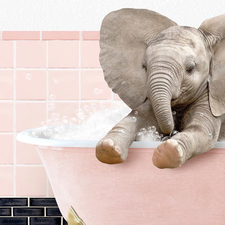 a baby elephant taking a bath in a bathtub