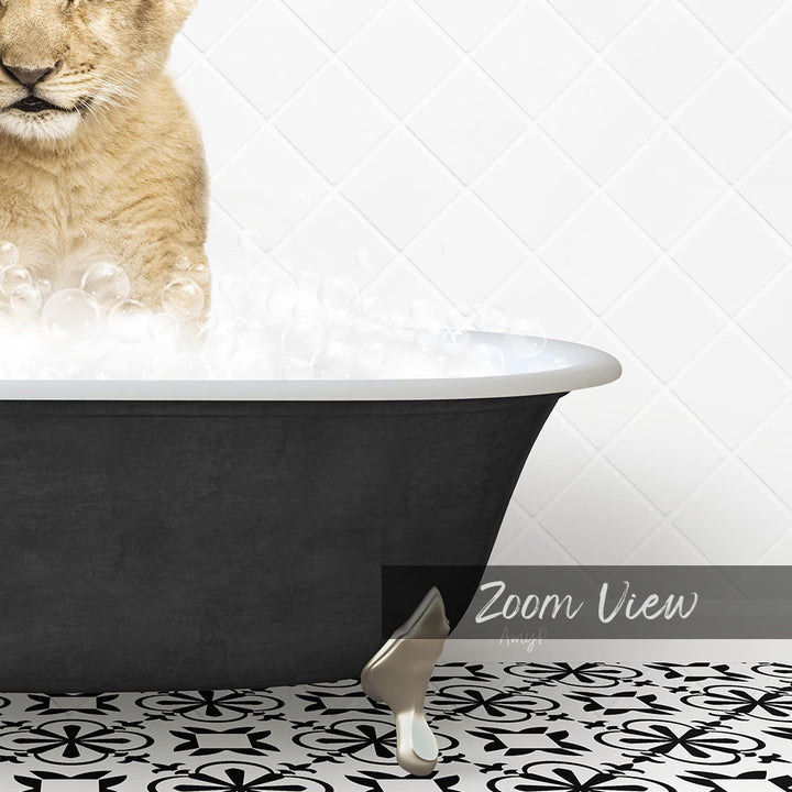A cat is sitting in a bathtub filled with bubbles, with a black and white patterned floor in the foreground.