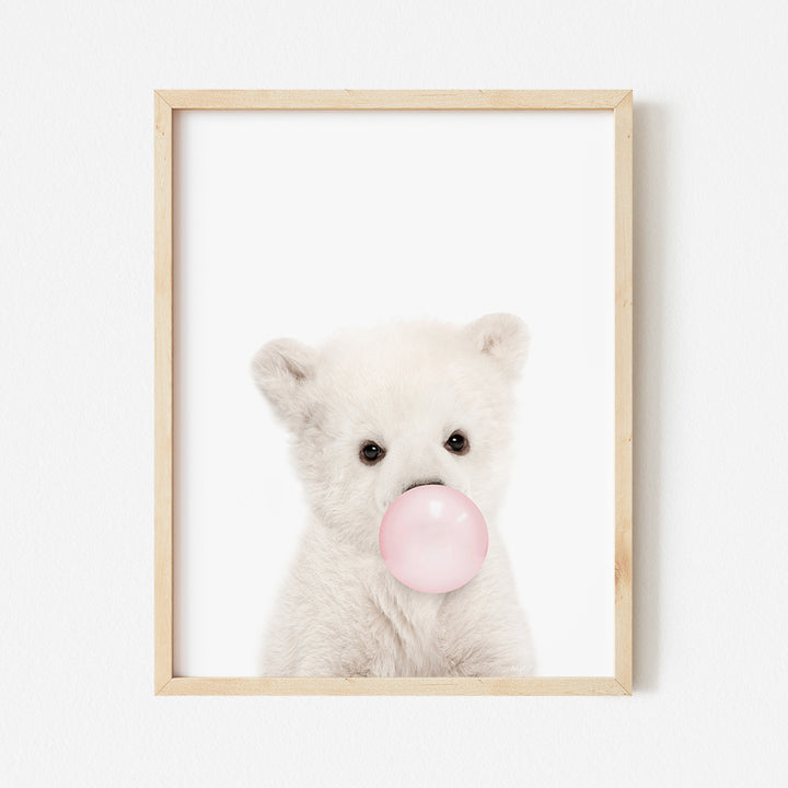 a white teddy bear with a pink bubble in its mouth