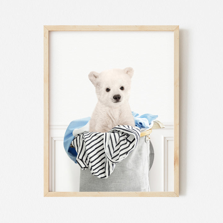 a white polar bear sitting in a bucket