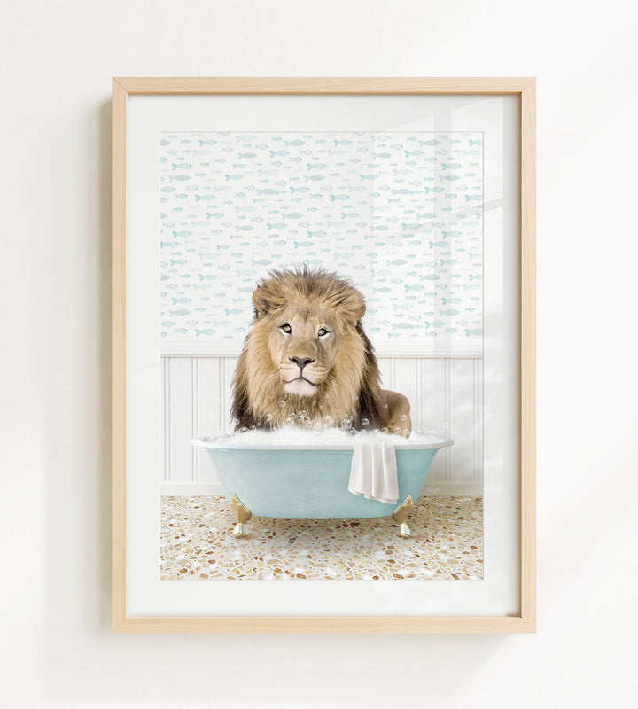 A lion sitting in a blue bathtub filled with bubbles, looking directly at the camera.