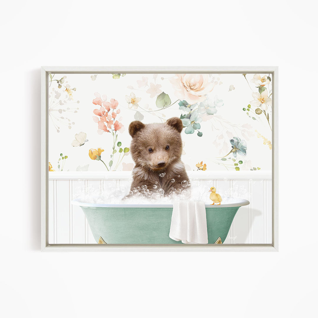 A cute brown bear sitting in a green bathtub filled with bubbles, surrounded by a floral wallpaper.