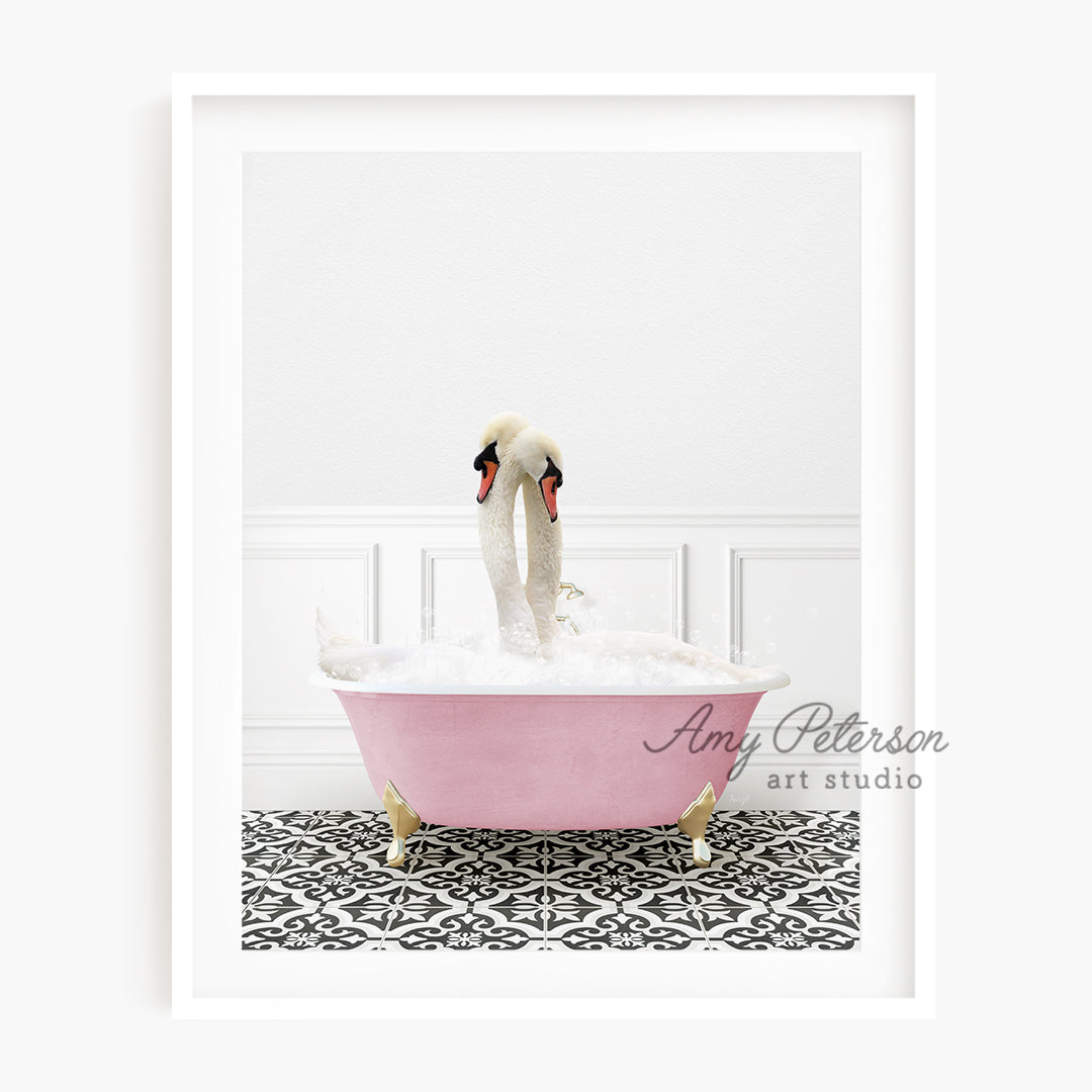 a pink bathtub with two swans in it