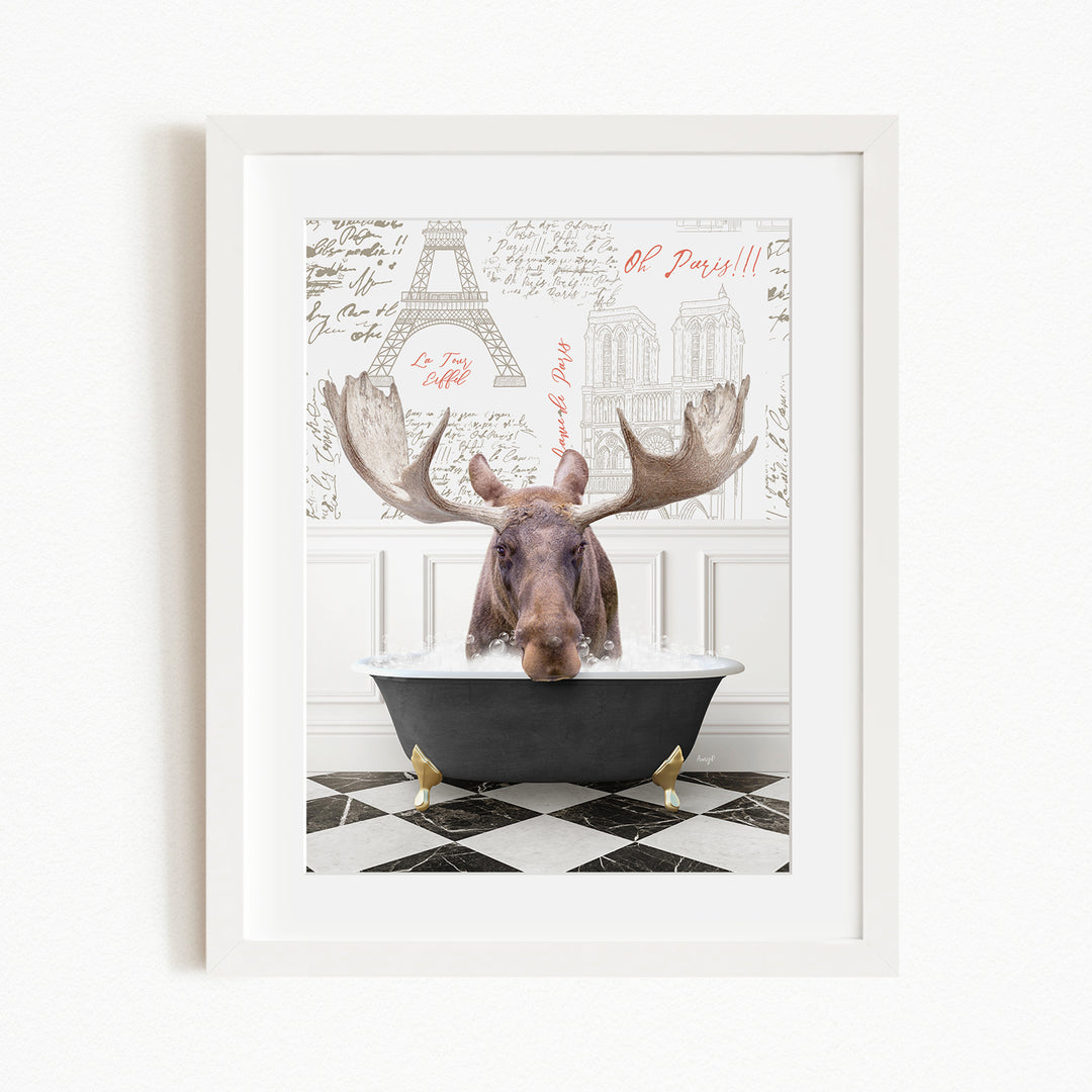 A moose is sitting in a bathtub, with a framed picture of the Eiffel Tower in the background.