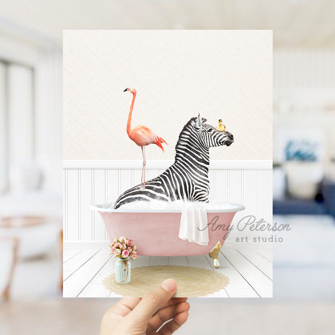 a hand holding a card with a zebra and a flamingo in a bathtub