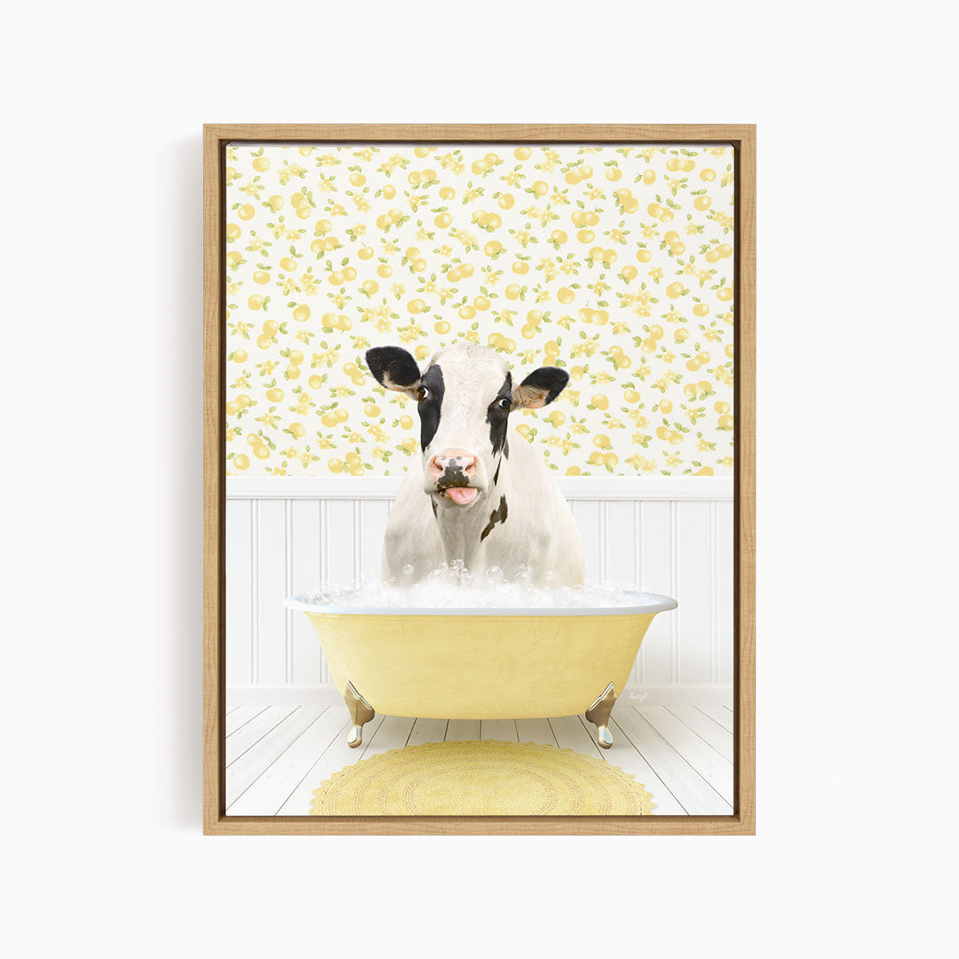 A black and white cow is sitting in a yellow bathtub filled with water, surrounded by a yellow floral wallpaper.