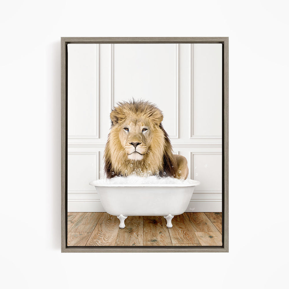 A lion sitting in a white bathtub filled with water, looking directly at the camera.