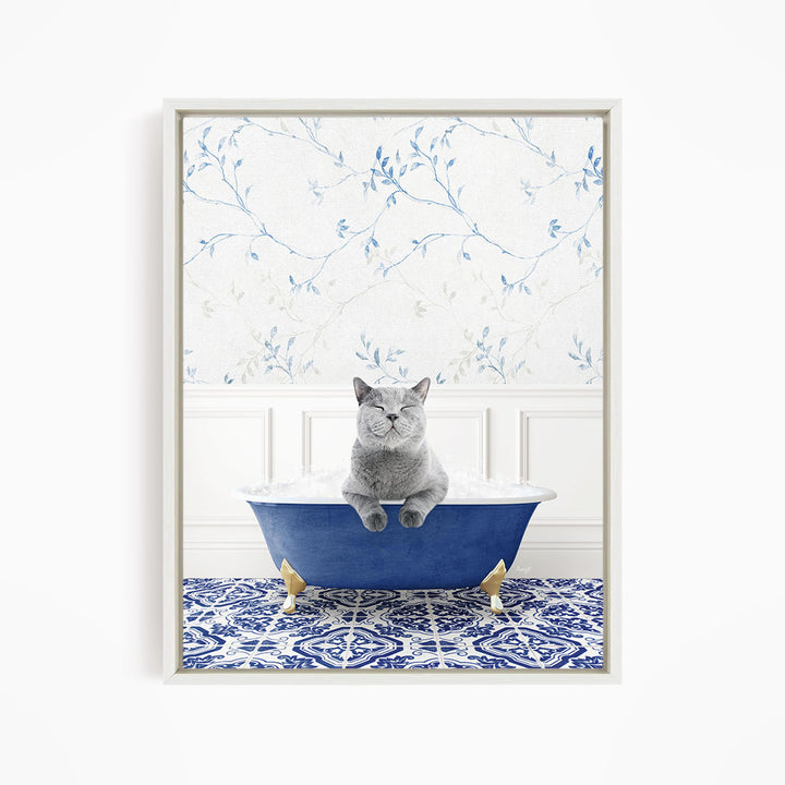A gray cat sitting in a blue bathtub, with a patterned tile floor and a floral wallpaper in the background.