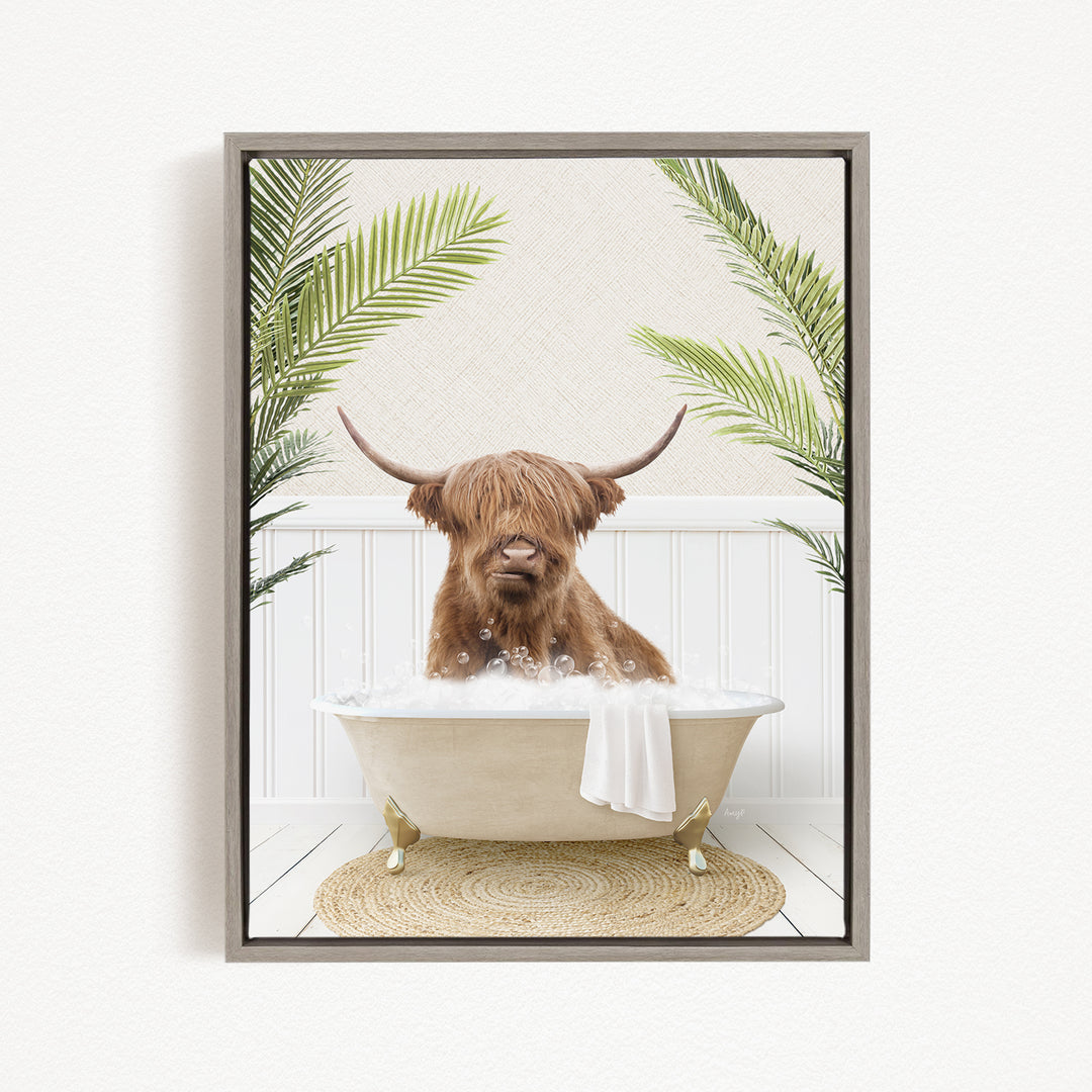 A brown cow with long horns is sitting in a bathtub filled with water, surrounded by green palm leaves.