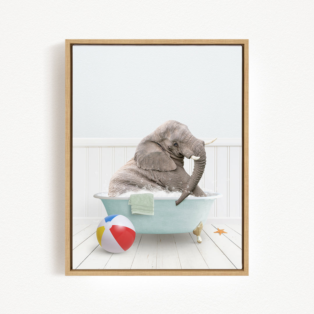 A gray elephant is sitting in a blue bathtub, surrounded by a beach ball and a starfish, creating a whimsical and playful scene.