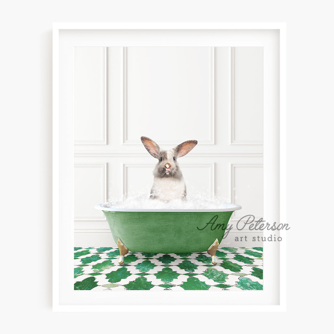 a rabbit sitting in a green bath tub