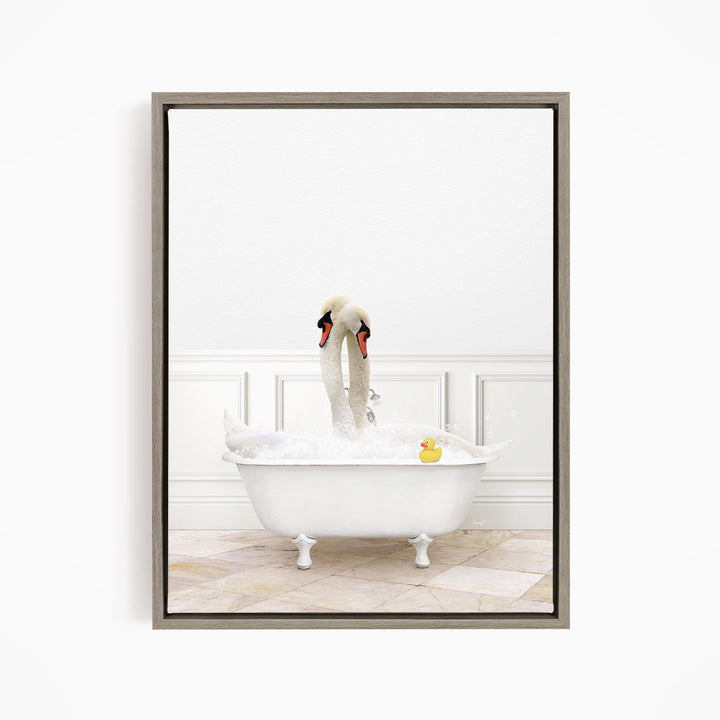 A white swan is sitting in a white bathtub, surrounded by bubbles, with a rubber duck floating nearby.