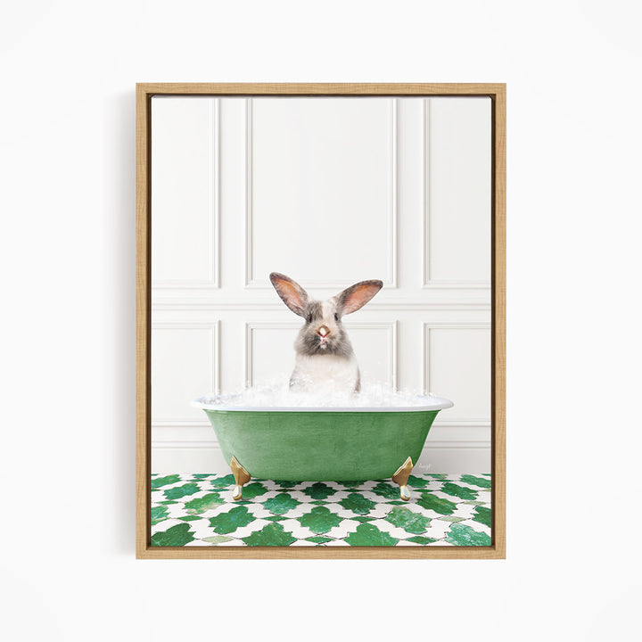 A white rabbit with brown ears is sitting in a green bathtub filled with water, looking directly at the camera.