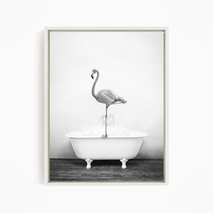 A flamingo standing on the edge of a white bathtub filled with water.