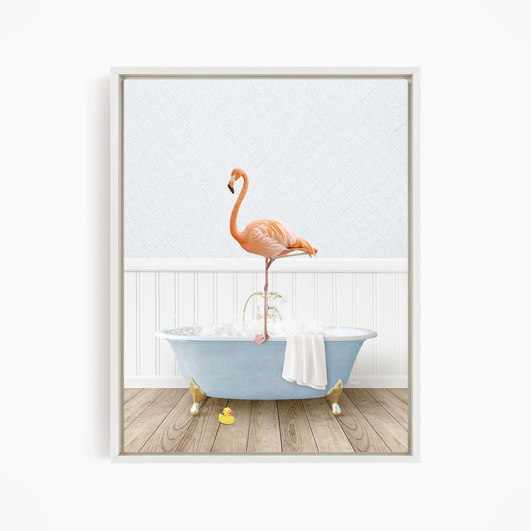 A pink flamingo stands on the edge of a blue bathtub filled with water, with a yellow rubber duck floating in the tub.
