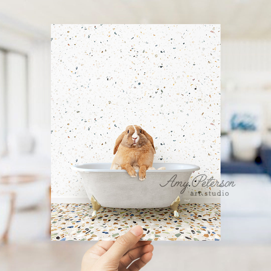 a person holding up a card with a picture of a rabbit in a bathtub