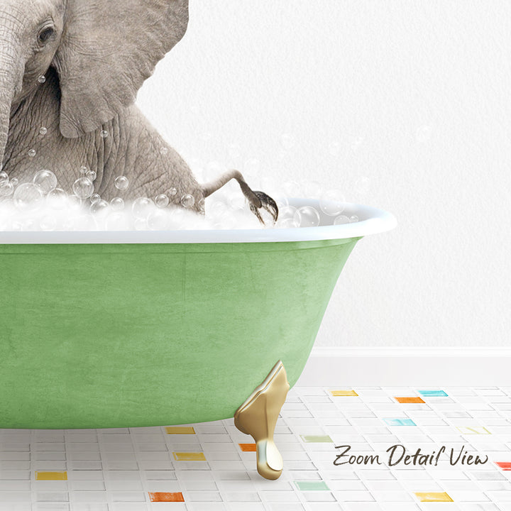 A large elephant is sitting in a green bathtub filled with bubbles, with its trunk submerged in the water.