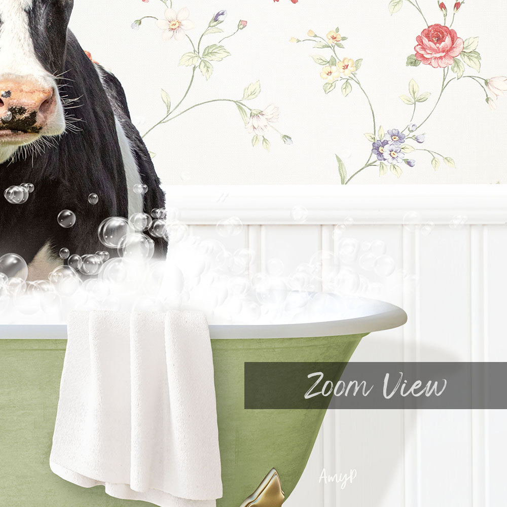 A black and white cow is sitting in a green bathtub filled with bubbles, with a floral wallpaper in the background.