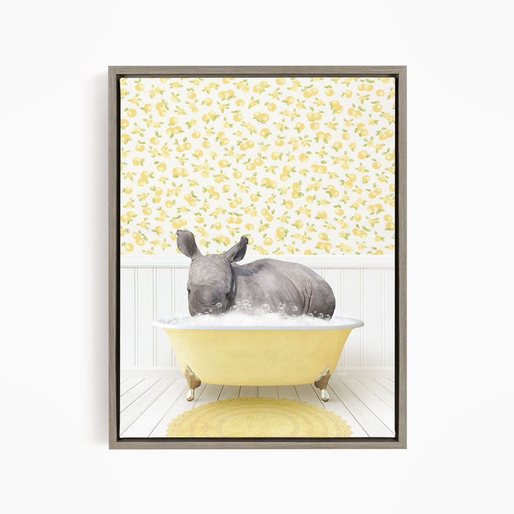 A rhinoceros is sitting in a yellow bathtub filled with water, surrounded by a yellow and white floral pattern on the wall behind it.