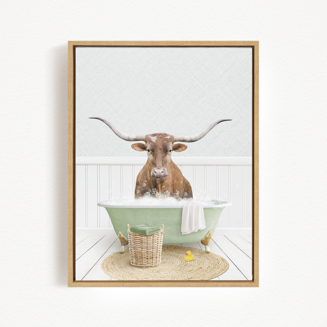 A brown cow with long horns is sitting in a green bathtub filled with bubbles, surrounded by a basket of rubber ducks and a woven basket.