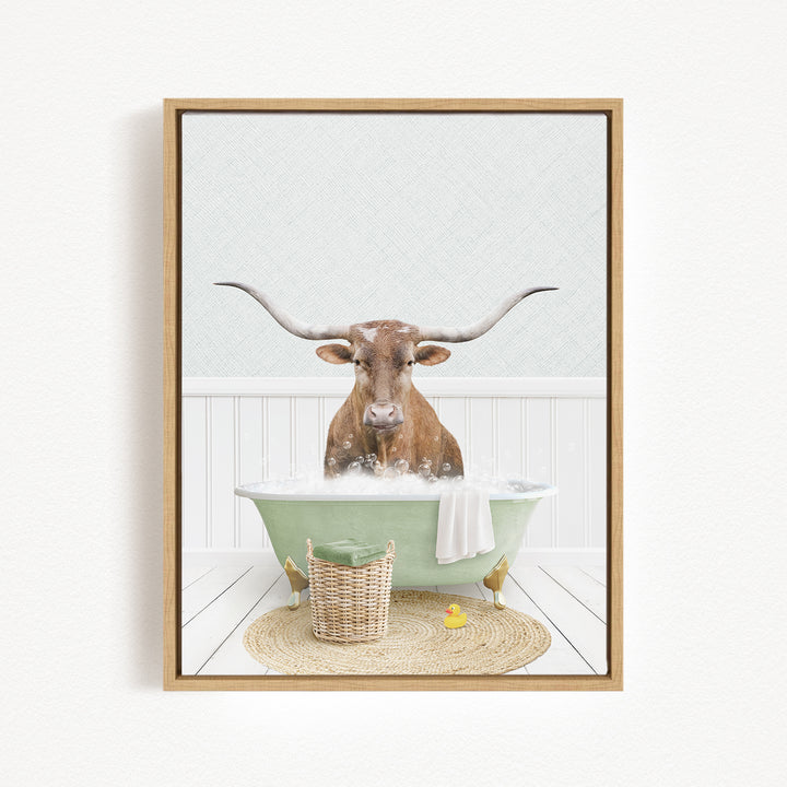 A brown cow with long horns is sitting in a green bathtub filled with bubbles, surrounded by a basket of rubber ducks and a woven basket.
