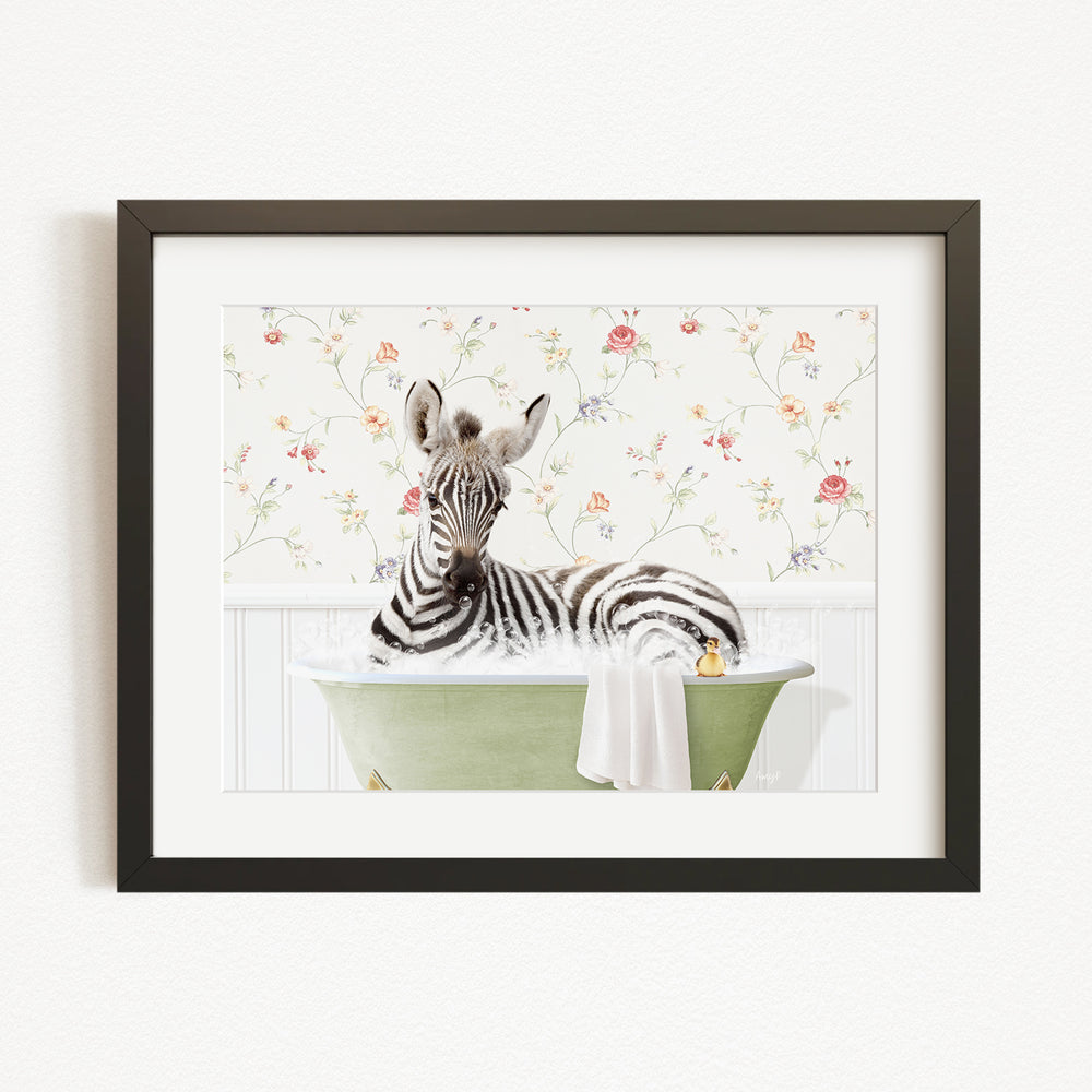 A zebra is sitting in a green bathtub filled with water, surrounded by a floral wallpaper.