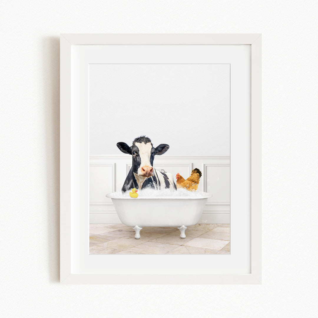 A black and white cow is sitting in a white bathtub, surrounded by a yellow rubber duck and a chicken, creating a whimsical and playful scene.