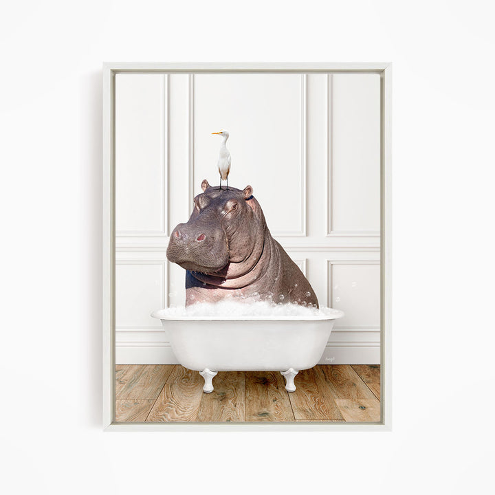 A large hippopotamus is sitting in a white bathtub, with a seagull perched on its head.