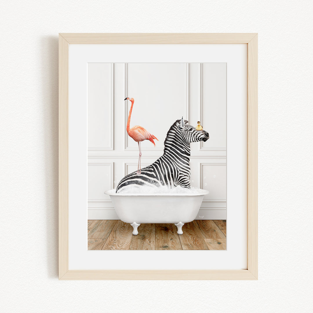 A framed image depicting a zebra sitting in a white bathtub, with a pink flamingo standing on its back.
