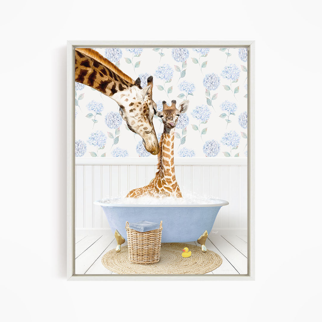 A giraffe and a baby giraffe are sitting in a blue bathtub, surrounded by a floral patterned wall and a basket of rubber ducks.