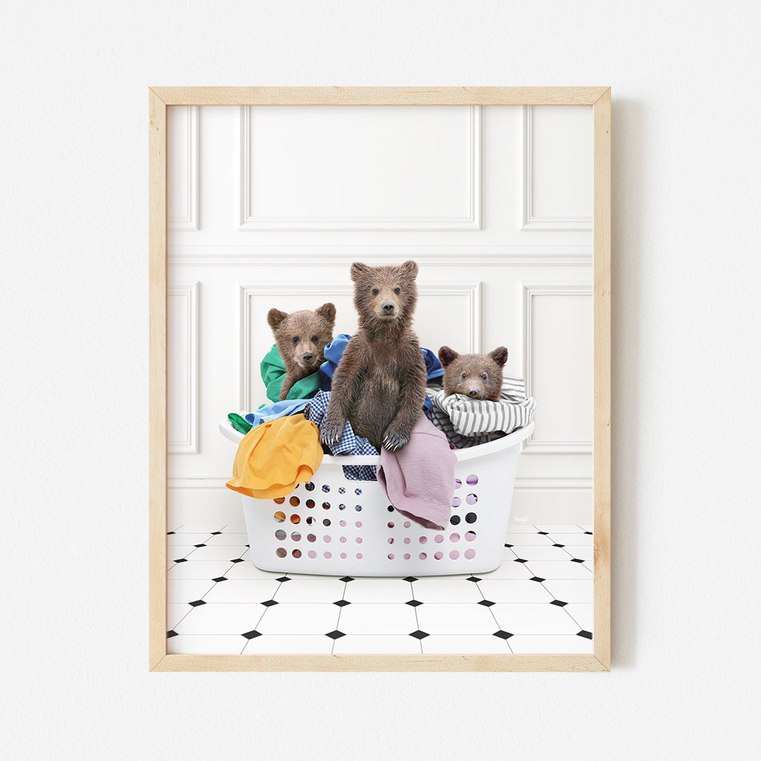 a group of teddy bears sitting in a laundry basket