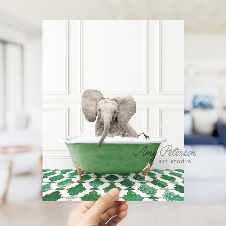 a hand holding a card with an elephant in a bathtub