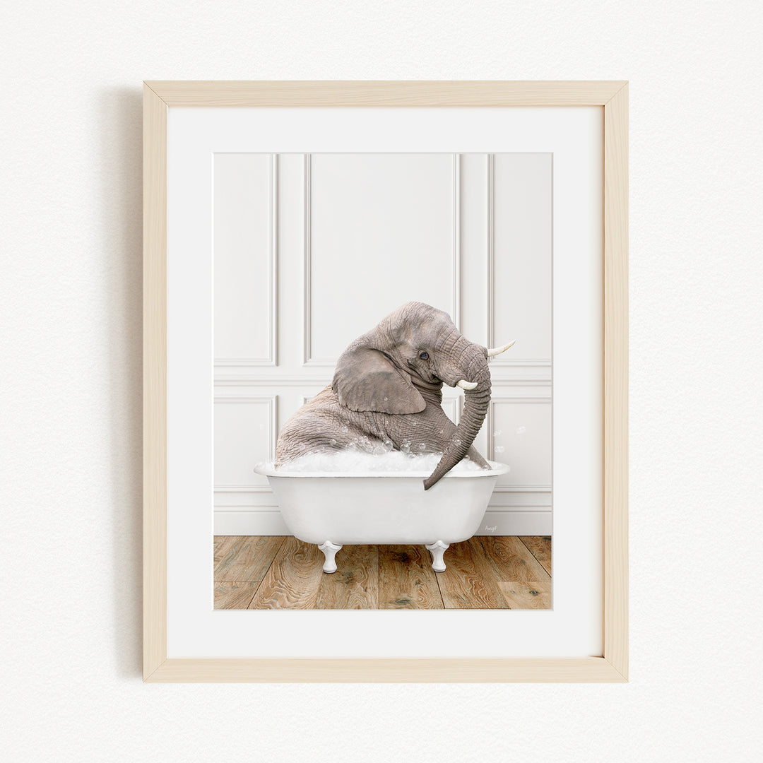 A gray elephant sitting in a white bathtub, with its trunk raised and appearing to be enjoying the bath.