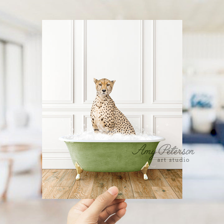 a cheetah sitting in a green bath tub