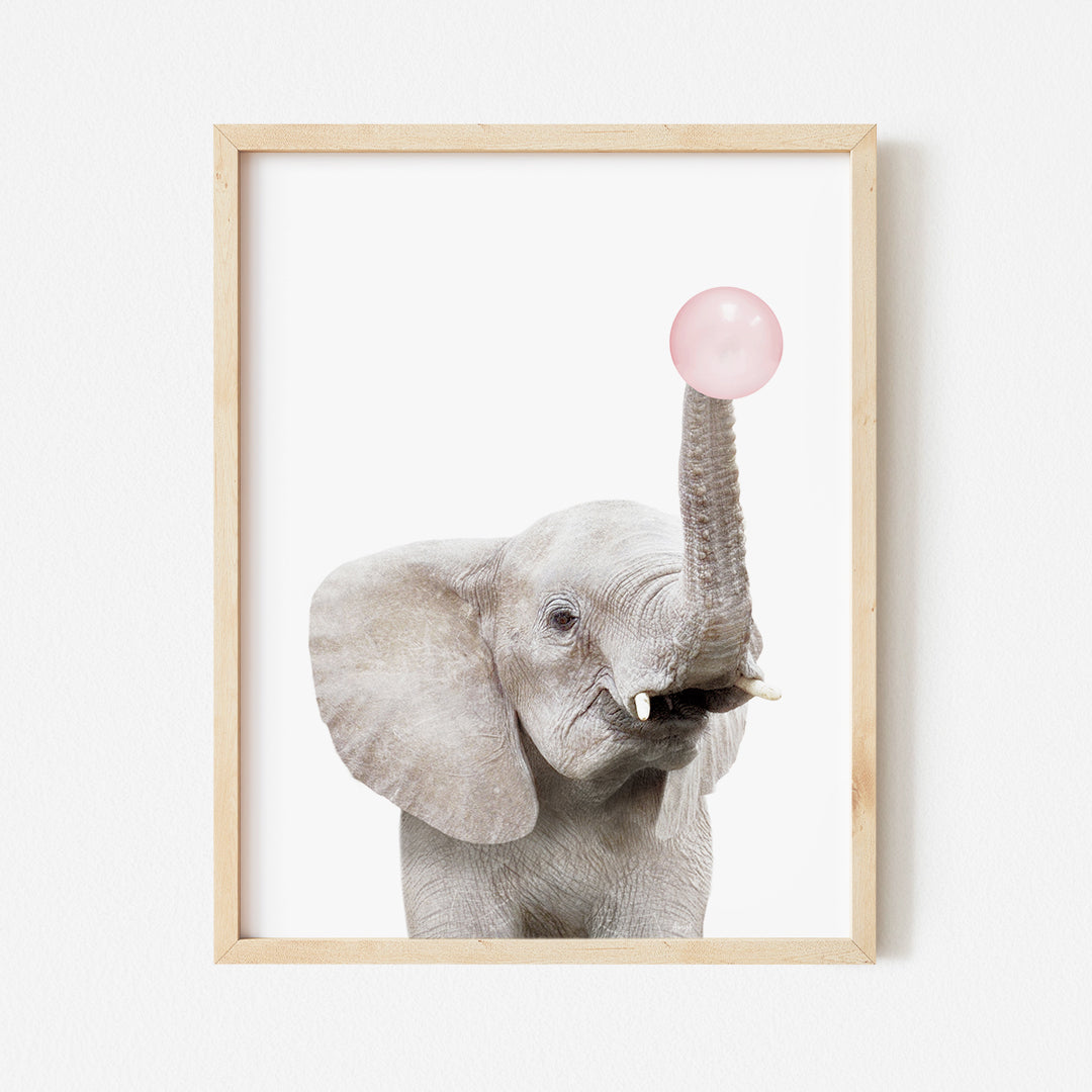 a picture of an elephant blowing a bubble