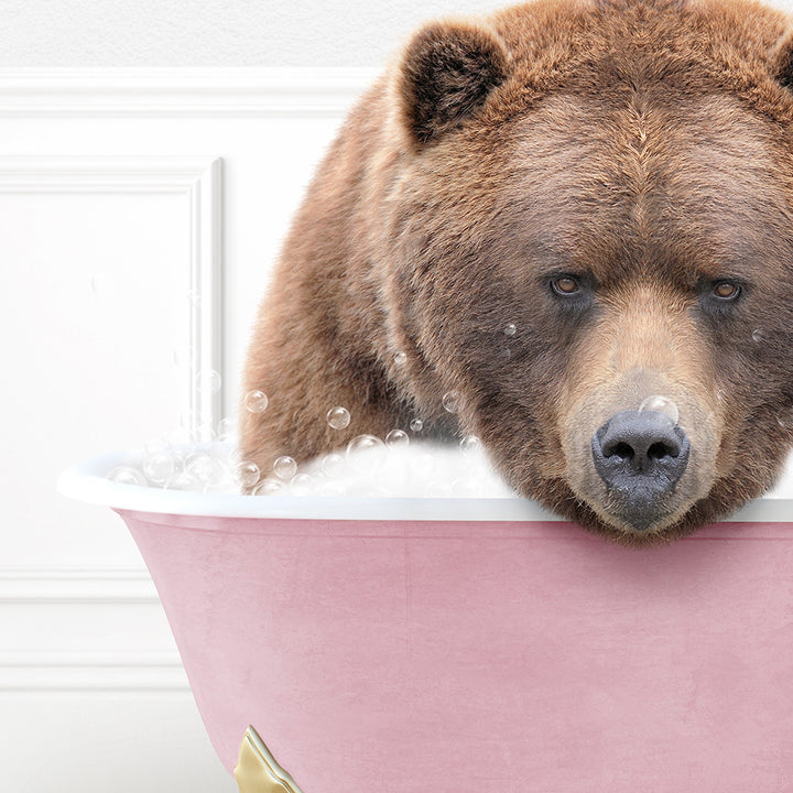 a large brown bear sitting in a bath tub