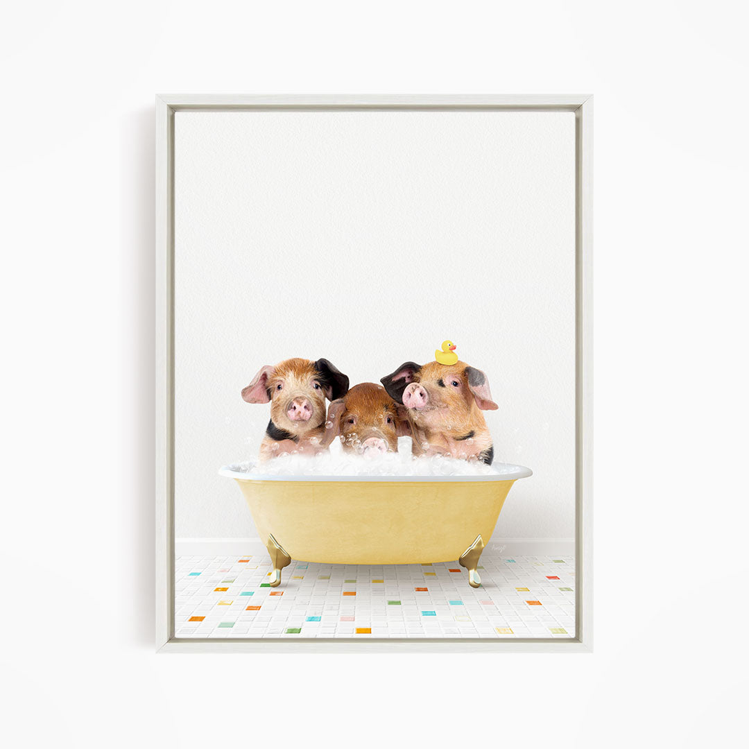 Three adorable pigs sitting in a yellow bathtub, with one of them wearing a yellow hat.