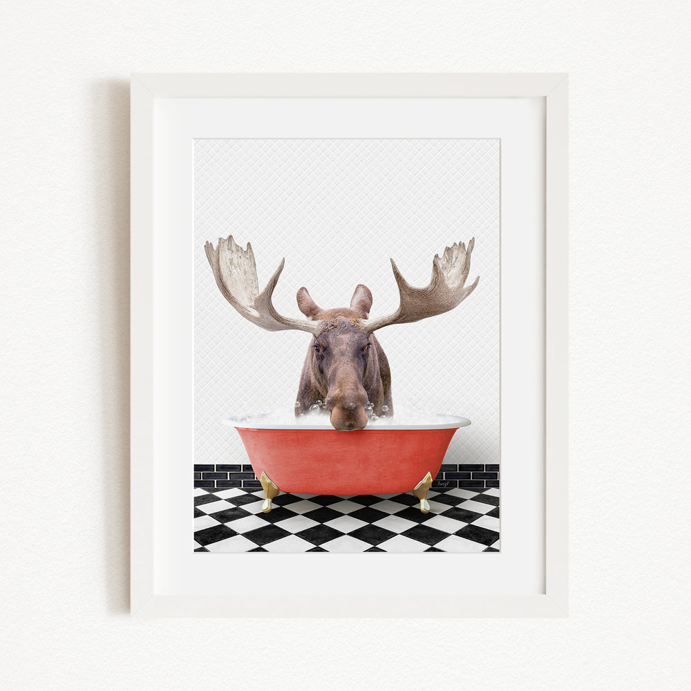 A moose with large antlers is sitting in a red bathtub, surrounded by a black and white checkered floor.
