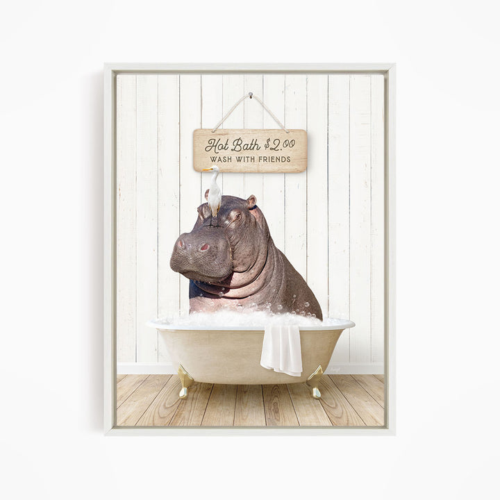 A framed image depicting a hippopotamus sitting in a bathtub, with a sign above it that reads "Hot Bath $2.00 WASH WITH FRIENDS".
