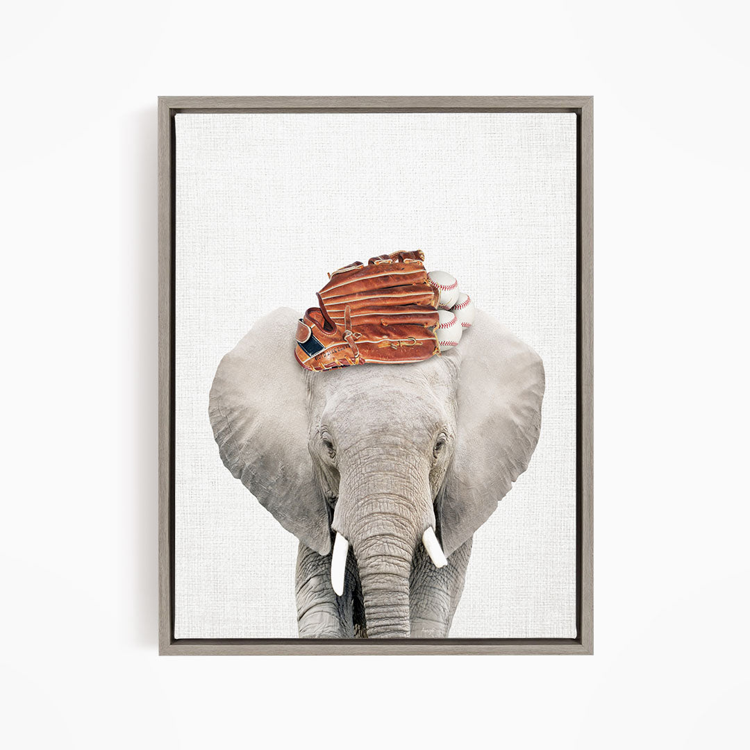 A gray elephant with a baseball glove on its head, standing against a white background.