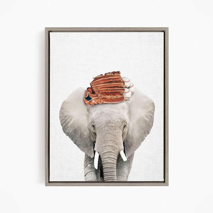 A gray elephant with a baseball glove on its head, standing against a white background.