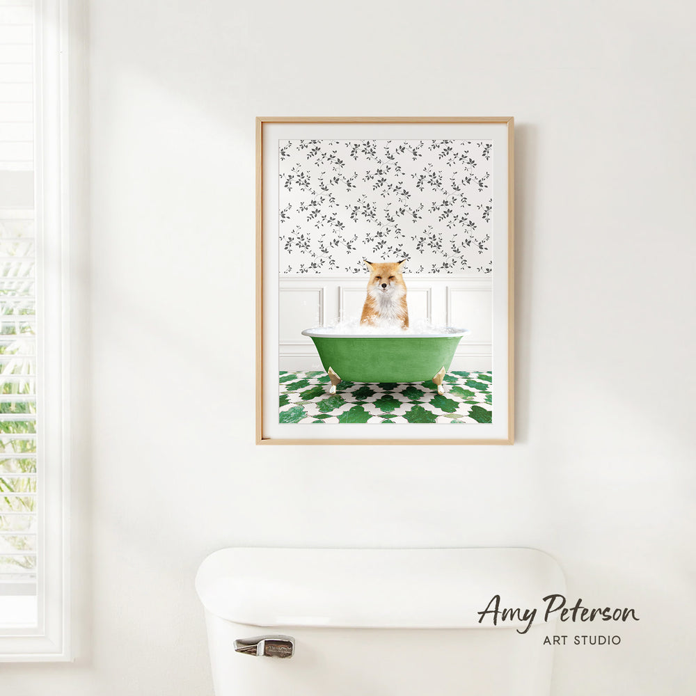 A framed image of a cat sitting in a green bathtub, with a patterned wall behind it.