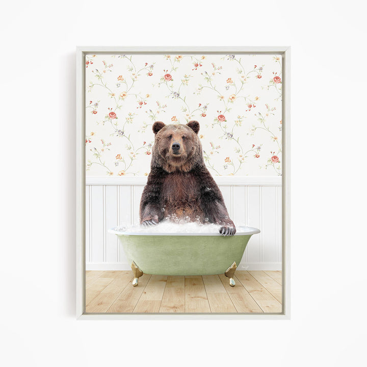 A brown bear sitting in a green bathtub filled with water, with a floral wallpaper in the background.